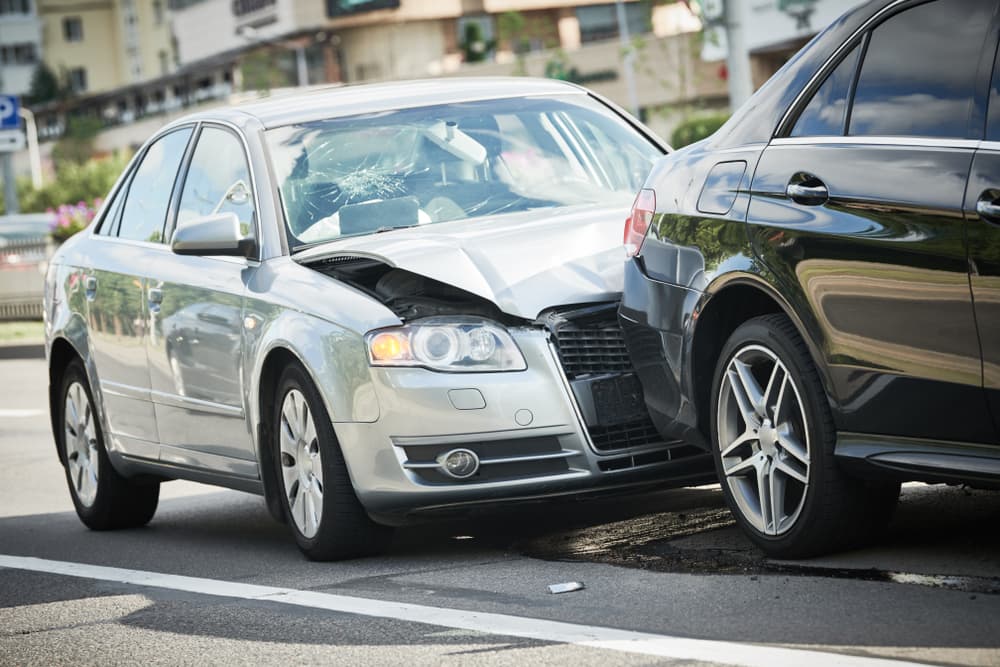 Street collision involving damaged vehicles.