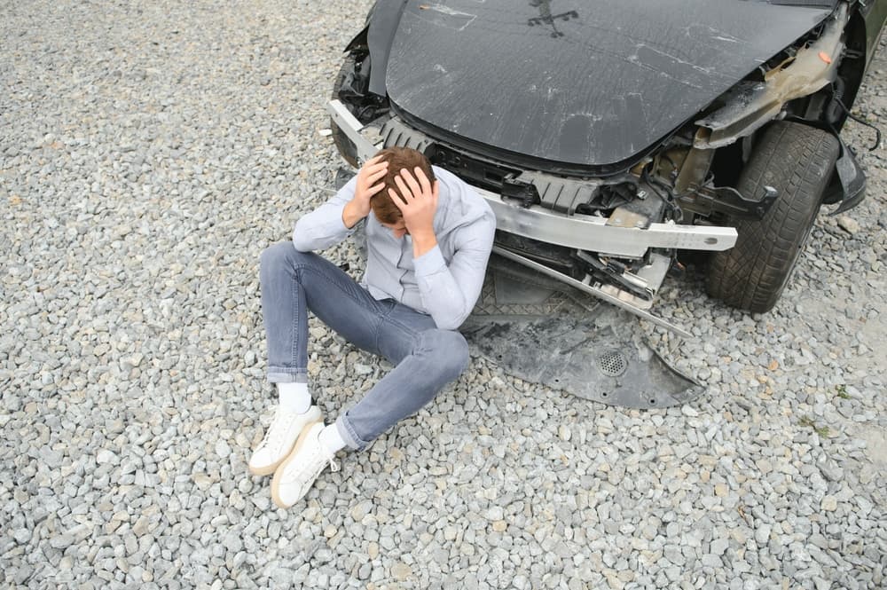 A man experiences pain after a car accident.






