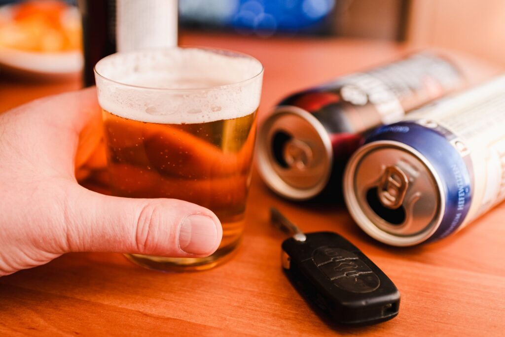Beer glass, cans, and car keys, representing cases handled by Zephyrhills Drunk Driving Accident Lawyers.