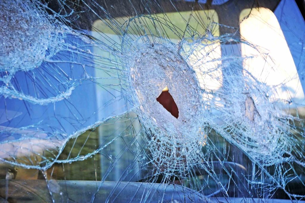 Shattered vehicle windshield after a collision, handled by Zephyrhills Truck Accident Lawyers.